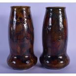 A PAIR OF ROYAL DOULTON STONEWARE VASES painted with leaves. 20 cm high.