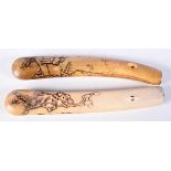 TWO 19TH CENTURY JAPANESE STAG ANTLER PIPECASES, ONE WITH TRAVELLER THE OTHER FLORAL. 19.5cm x 3.5