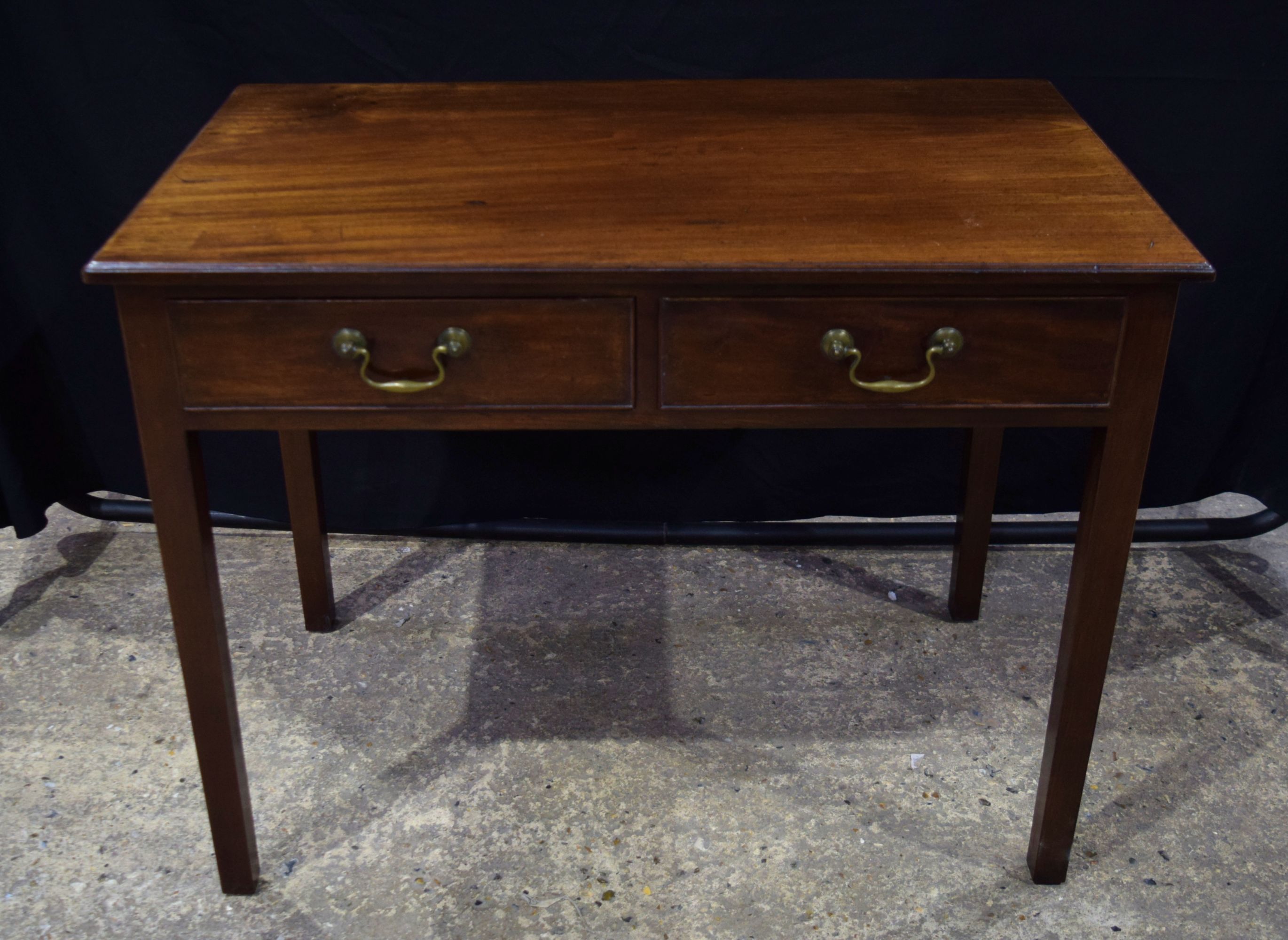 A 19th century oak two drawer side table 70 x 92 x 52 cm.