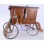 A large antique wooden model of a caravan with assorted domestic items. 54 x 53 x 36cm