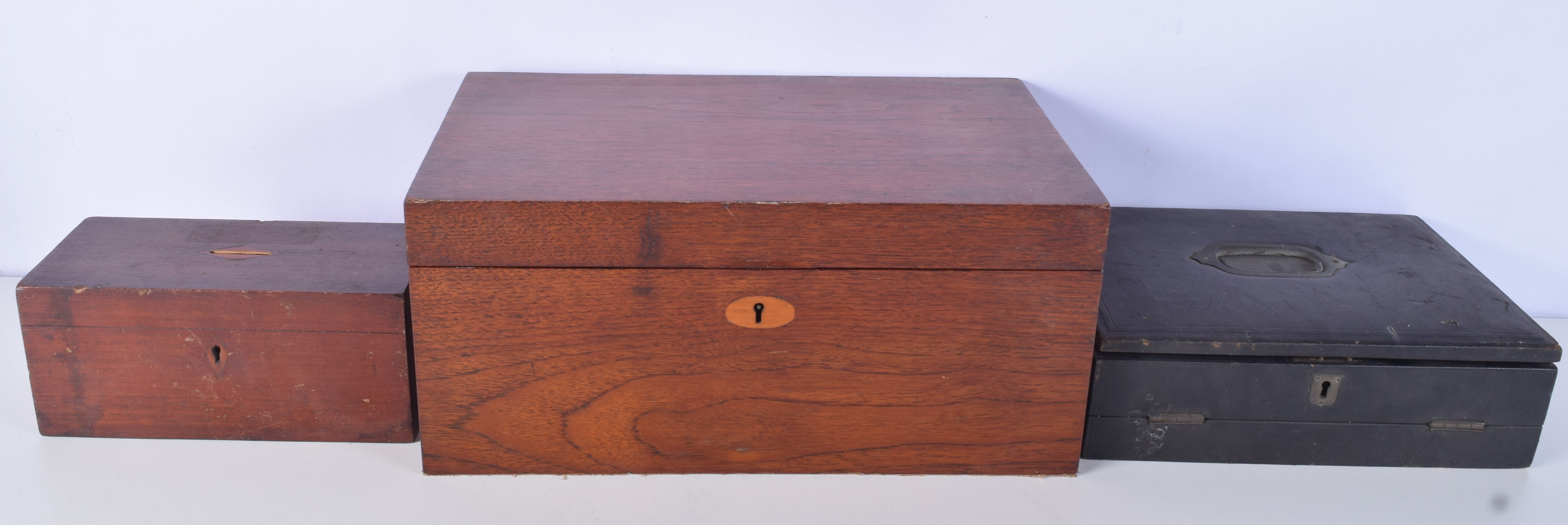 A Victorian Leather wring box together with a wooden stationary box and a wooden donations box large