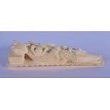A 19TH CENTURY CHINESE CARVED IVORY FIGURE OF A FEMALE modelled reclining lady. 9 cm x 3 cm.