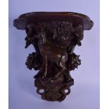 A 19TH CENTURY BAVARIAN BLACK FOREST WALL BRACKET modelled as a deer under foliage. 27 cm x 22 cm.