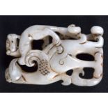 A carved white Jade boulder in the form of two beasts. 8 x 5cm
