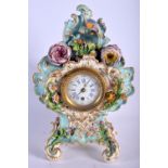 A MID 19TH CENTURY ENGLISH PORCELAIN MANTEL CLOCK encrusted with flowers. 29 cm x 15 cm.