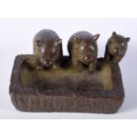 A JAPANESE BRONZE OF THREE PIGS AT A TROUGH. 2.4cm x 4.7cm x 3.3cm, weight 106g