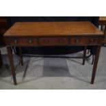 An antique mahogany sideboard with a single central door flanked by two dummy drawers.92 x 136 x68cm