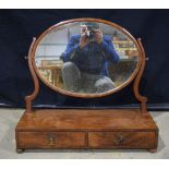 A large19th century mahogany dressing mirror, oval swing plate, 2 drawers to base , rosewood carved