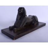 A 19TH CENTURY FRENCH EGYPTIAN REVIVAL BRONZE FIGURE OF A SPHINX. 34 cm x 16 cm.