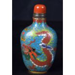 A Cloisonne enamelled snuff bottle decorated with a dragon. 8.5cm