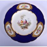19TH C. COALPORT FINE PLATE PAINTED BY WM. COOK WITH BIRDS AND FLOWERS IN JEWELLED PANELS ON A BLUE