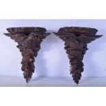 A pair of carved Black forest wooden sconces in the form of eagles 32 x29cm (2).
