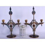 A PAIR OF 19TH CENTURY FRENCH CHAMPLEVE ENAMEL CANDLESTICKS. 32 cm x 17 cm.