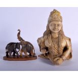 AN INDIAN CARVED MARBLE DEITY together with a carved Rhinoceros horn elephant C1910. Largest 18 cm x