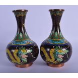 A PAIR OF EARLY 20TH CENTURY CHINESE CLOISONNE ENAMEL VASES decorated with dragons. 16 cm high.