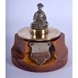 A RARE EARLY 20TH CENTURY EUROPEAN BRONZE AND CATALIN BAKELITE INKWELL formed with a seated Chinaman