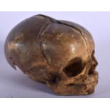 A RARE 19TH CENTURY TRIBAL DAYAK TYPE SKULL probably from a monkey. 10 cm x 8 cm.