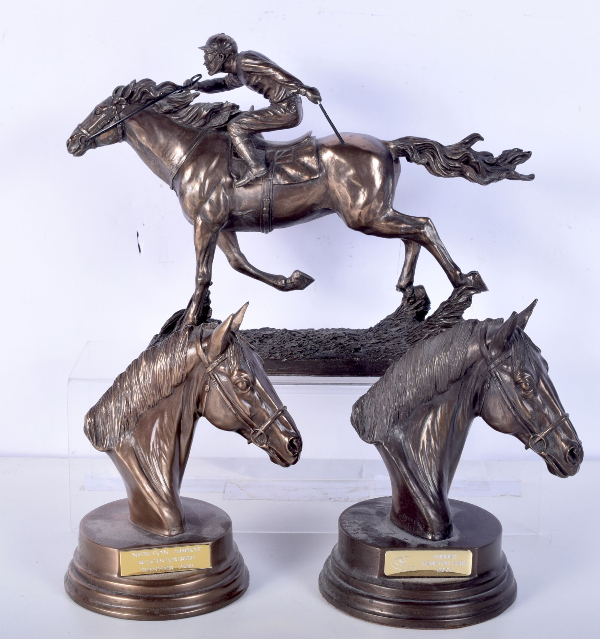 A collection of small Spelter and bronzed metal horse racing trophies 22 x 30 cm (3)