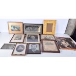 A collection of framed photographs and 1950's magazines