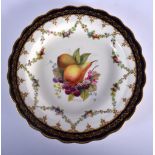 ROYAL WORCESTER PLATE PAINTED WITH FRUIT UNDER A BLUE AND GILT BORDER BY E. PHILLIPS, SIGNED, DATE M