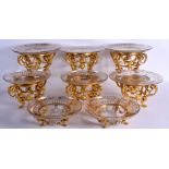 A MAGNIFCANT SUITE OF MID 19TH CENTURY FRENCH ORMOLU AND GILDED GLASS PEDESTAL DISHES by Barbedienne