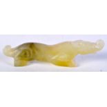 A CHINESE JADE BRUSH REST IN THE FORM OF A MYTHICAL CREATURE. 2.8cm x 11.8cm x 1.9cm, weight 79g
