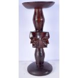 A carved North American Native carved stand/stool 52 cm.