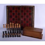 A CHARMING ANTIQUE BOXWOOD AND EBONY CHESS SET within a case, together with a folding faux leather b