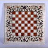 A 19TH CENTURUY ITALIAN AGRA MARBLE CHESS BOARD decorated with foliage and vines. 34 cm square.