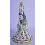 A RARE 19TH CENTURY FRENCH FAIENCE GLAZE JESTER TYPE BELL modelled in floral robes. 21 cm x 8 cm.