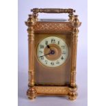 A FRENCH BRASS CARRIAGE CLOCK with circular enamelled dial. 15 cm high.