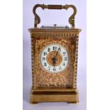 A FINE REPEATING BRASS CARRIAGE CLOCK with well decorated floral face. 18.5 cm high inc handle.