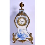 A 19TH CENTURY EUROPEAN PORCELAIN MANTEL CLOCK painted with figures and landscapes. 30 cm x 12 cm.