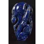 A carved Lapis Lazuli boulder in the form of a fruiting pod and an insect. 7cm