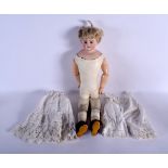 AN ANTIQUE GERMAN BISQUE HEAD PORCELAIN DOLL. 55 cm long.