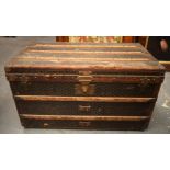 A FRENCH GOYARD TRUNK with wood and brass banding. 85 cm x 48 cm x 48 cm.