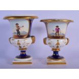 A NEAR PAIR OF EARLY 19TH CENTURY ENGLISH PORCELAIN CAMPAGNA VASES painted with figures within lands