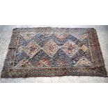 A large Persian rug 246 x150cm.