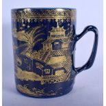 A RARE 18TH CENTURY CHINESE EXPORT POWDER BLUE GROUND MUG Qianlong, gilded with landscapes. 14 cm x