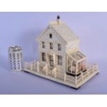 AN EXTREMELY RARE 19TH CENTURY GERMAN CARVED IVORY MODEL OF A HOUSE with attached glass green house.