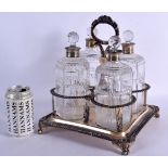 A GEORGE III SILVER AND FOUR GLASS DECANTER SET. Weighable silver 1068 grams. 30 cm x 20 cm. (5)