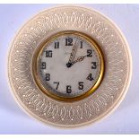 AN ANTIQUE CARVED IVORY EIGHT DAY CLOCK. 9.5 cm diameter.