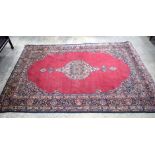 A large Persian rug 329 x 218 cm.