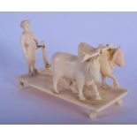 A 19TH CENTURY INDIAN CARVED IVORY FIGURE OF AN OXEN CART modelled upon a rectangular base. 10 cm x