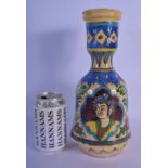 A MIDDLE EASTERN PERSIAN FAIENCE GLAZED HOOKAH PIPE VASE painted with portraits. 28 cm high.