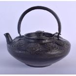 A 19TH CENTURY TIBETAN MIXED ALLOY TEAPOT AND COVER overlaid with Buddhistic motifs. 15 cm x 18 cm i