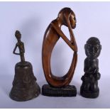AN EARLY 20TH CENTURY AFRICAN TRIBAL CARVED WOOD FERTILITY FIGURE together with a bronze bell etc. L