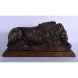 AN EARLY 20TH CENTURY EUROPEAN BRONZE FIGURE OF A SLEEPING LION After the Antiquity, modelled upon a
