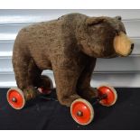 A Pull along Steiff bear on wheels with growler 44 x 56cm.