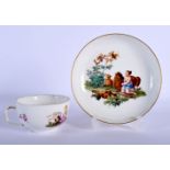 MEISSEN TEACUP AND SAUCER PAINTED WITH A LANDSCAPE VIGNETTE DEPICTING CHILDREN IN CLASSICAL ROBES WI